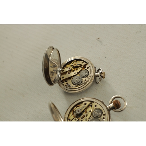 383 - TWO SILVER CASED FOB WATCHES a half hunter with enamel dial fronting a keyless wound spring driven m... 