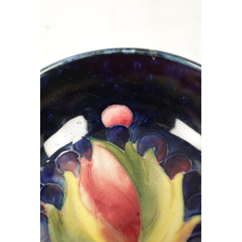 39 - A WILLIAM MOORCROFT SMALL-FOOTED BOWL CIRCA 1930'S/40'S the centre incised and decorated in the leaf... 