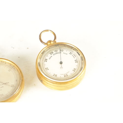 394 - TWO GILT BRASS CASED POCKET BAROMETERS, one in the originally Moroccan leather case, the other signe... 