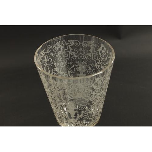 4 - A 20TH CENTURY BOHEMIAN CRYSTAL GLASS-LIDDED GOBLET of faceted form with etched scrollwork decoratio... 