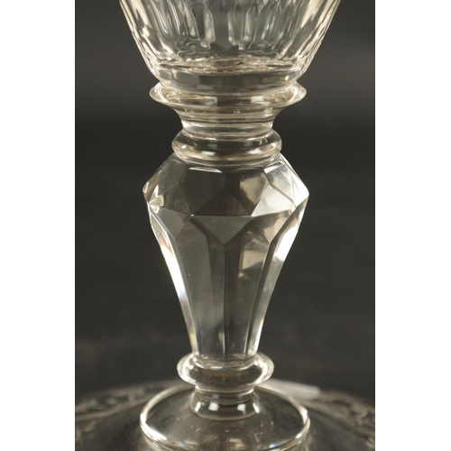 4 - A 20TH CENTURY BOHEMIAN CRYSTAL GLASS-LIDDED GOBLET of faceted form with etched scrollwork decoratio... 