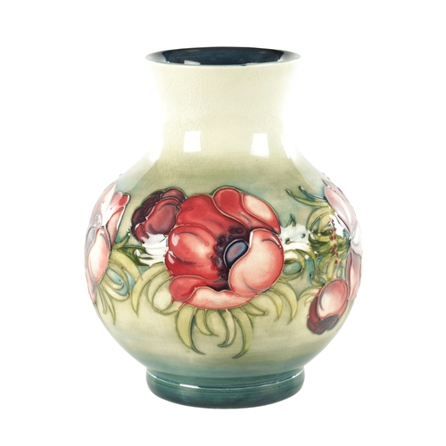 40 - AN ANEMONE PATTERN MOORCROFT VASE, with tube lined floral decoration, impressed marks and signature ... 