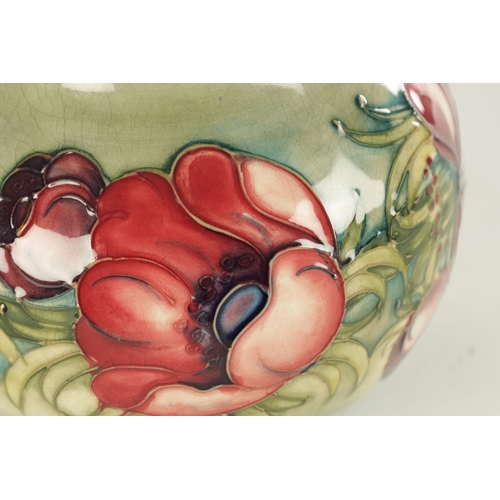 40 - AN ANEMONE PATTERN MOORCROFT VASE, with tube lined floral decoration, impressed marks and signature ... 