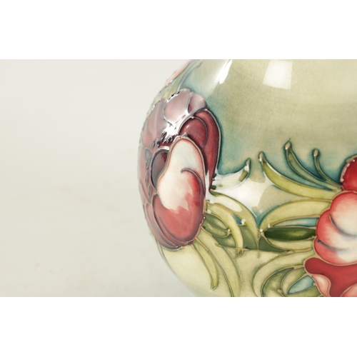 40 - AN ANEMONE PATTERN MOORCROFT VASE, with tube lined floral decoration, impressed marks and signature ... 