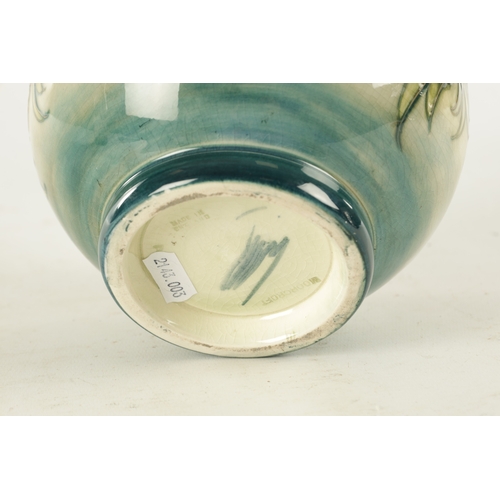 40 - AN ANEMONE PATTERN MOORCROFT VASE, with tube lined floral decoration, impressed marks and signature ... 