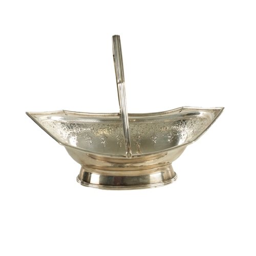 404 - A GEORGE III SILVER SWEETMEAT BASKET the ovoid octagonal shaped dish with bright cut decoration and ... 