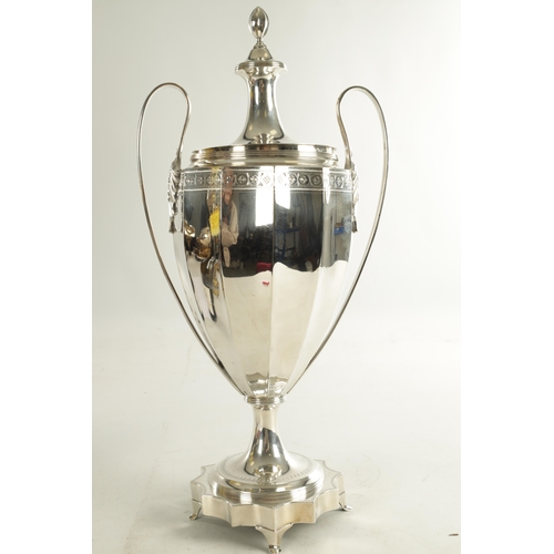 406 - A GEORGE III ADAM DESIGN SILVER TEA URN the concave panelled tapering body with raised ribbed leaf c... 