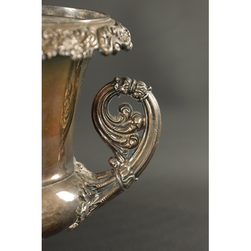 409 - THREE PIECES OF 19TH CENTURY SILVER-PLATED WARE comprising of an ice bucket, lidded jug and a tankar... 