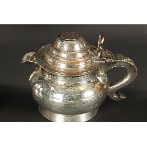 409 - THREE PIECES OF 19TH CENTURY SILVER-PLATED WARE comprising of an ice bucket, lidded jug and a tankar... 