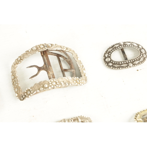 412 - A COLLECTION OF NINE 19TH CENTURY SILVER AND SILVER METAL BELT BUCKLES of varying designs (9cm long ... 