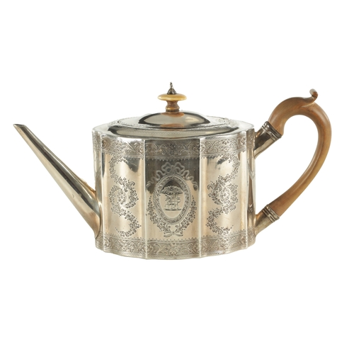 414 - A GEORGE III SILVER TEAPOT of bright-cut shaped octagonal form with tapered spout, shaped pearwood h... 