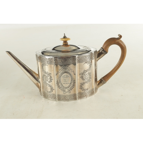 414 - A GEORGE III SILVER TEAPOT of bright-cut shaped octagonal form with tapered spout, shaped pearwood h... 