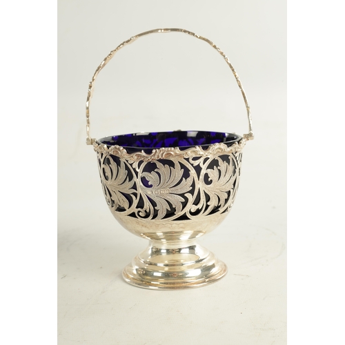 415 - A VICTORIAN SILVER BASKET WITH BLUE GLASS LINER with scrolled open leafwork body, hatched, flowerhea... 