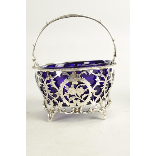 415 - A VICTORIAN SILVER BASKET WITH BLUE GLASS LINER with scrolled open leafwork body, hatched, flowerhea... 