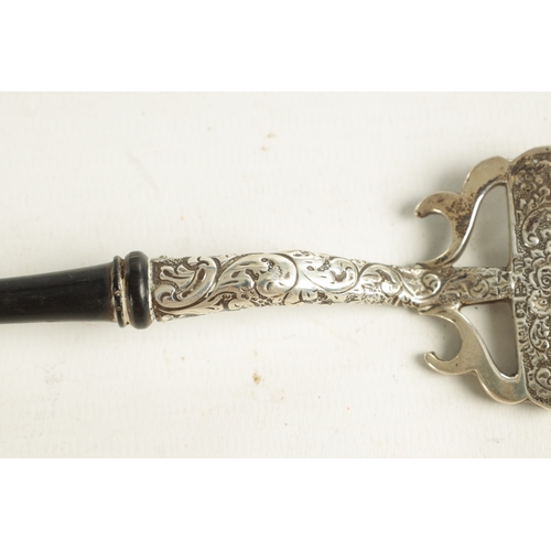 416 - A GEORGIAN SILVER PUNCH LADLE with coin inset to the base dated 1766 and twisted whalebone handle. T... 