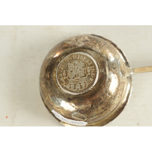 416 - A GEORGIAN SILVER PUNCH LADLE with coin inset to the base dated 1766 and twisted whalebone handle. T... 