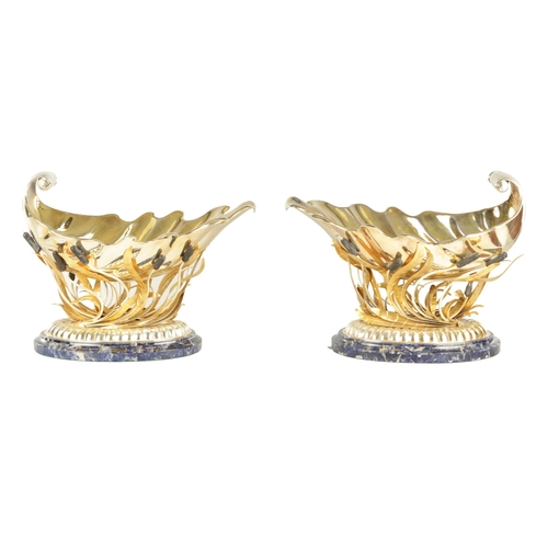 417 - A FINE AND IMPRESSIVE PAIR OF ELIZABETH II SILVER GILT SHELLWORK CHAMPAGNE COOLERS the bodies suppor... 