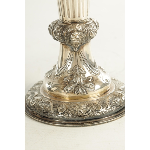 418 - A GEORGE III GIANT-SIZE SILVER GOBLET the body deeply embossed with winged cherub heads, leafing fru... 