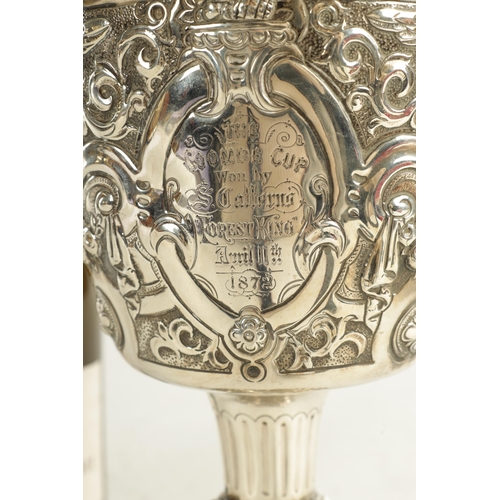 418 - A GEORGE III GIANT-SIZE SILVER GOBLET the body deeply embossed with winged cherub heads, leafing fru... 