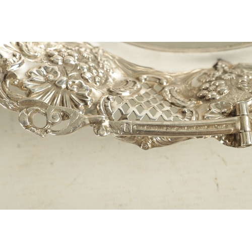 425 - EDWARD VII OVAL SILVER FRUIT BASKET with ornate cast folding handle and pierced fruiting vine work b... 