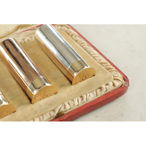 426 - AN EARLY 20TH CENTURY THREE SILVER 'SHOTGUN' CARTRIDGE PEPPER SHAKERS in three varying finishes, one... 