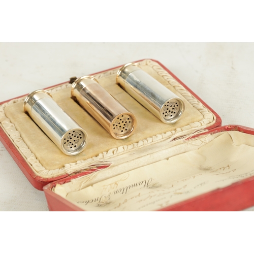 426 - AN EARLY 20TH CENTURY THREE SILVER 'SHOTGUN' CARTRIDGE PEPPER SHAKERS in three varying finishes, one... 