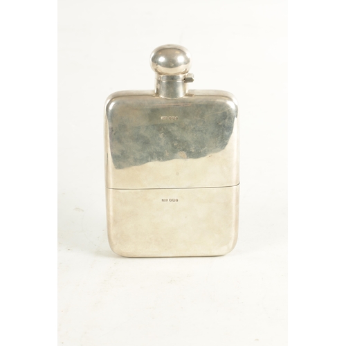 433 - A LARGE GEORGE V SILVER HIP FLASK of plain rectangular slightly bowed form, engraved crest, with twi... 