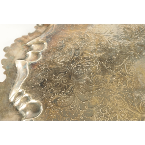 439 - A LARGE 19TH CENTURY OLD SHEFFIELD SIVER-PLATED TRAY with rococo style leaf and shell decorated bord... 