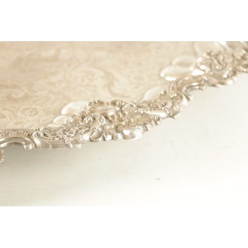 439 - A LARGE 19TH CENTURY OLD SHEFFIELD SIVER-PLATED TRAY with rococo style leaf and shell decorated bord... 