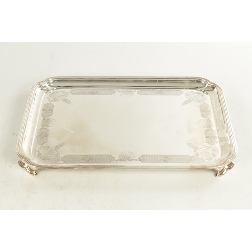 441 - A LARGE MID 20TH CENTURY SILVER RECTANGULAR TRAY with clipped corners and shell engraved border rais... 