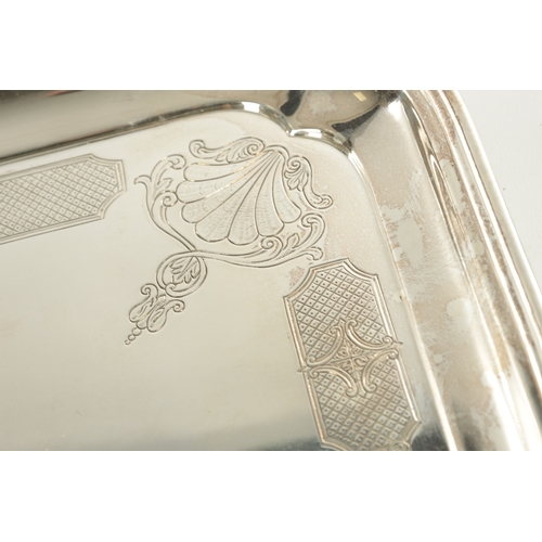 441 - A LARGE MID 20TH CENTURY SILVER RECTANGULAR TRAY with clipped corners and shell engraved border rais... 