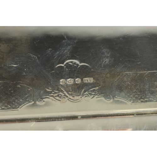 441 - A LARGE MID 20TH CENTURY SILVER RECTANGULAR TRAY with clipped corners and shell engraved border rais... 