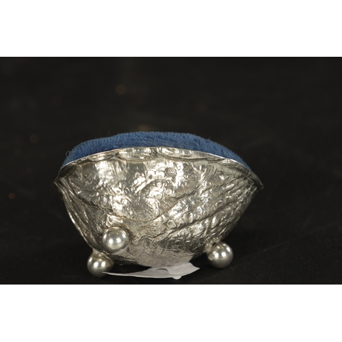 445 - A LATE 19TH CENTURY SILVER PINCUSHION ENCLOSED IN WALNUT SHELL Birmingham, 1888