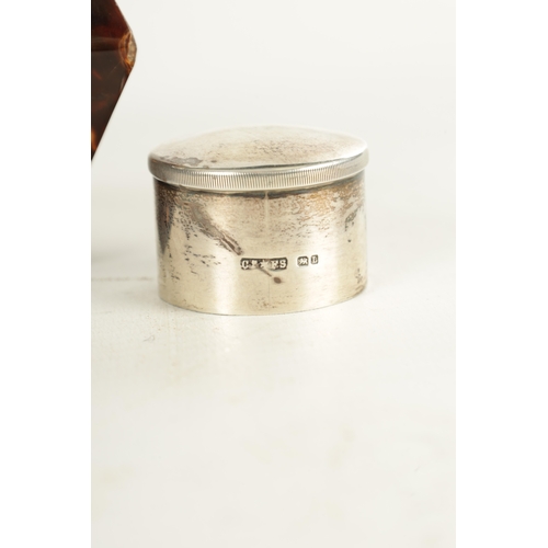 446 - A LATE 19TH CENTURY SILVER AND TORTOISESHELL TEA CADDY with angled silver top and push on lid above ... 