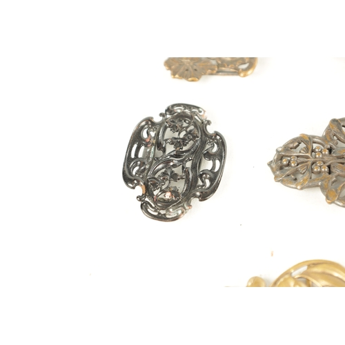 453 - A COLLECTION OF TEN 19TH CENTURY ART NOUVEAU SILVER AND SILVER METAL BELT BUCKLES of varying designs... 