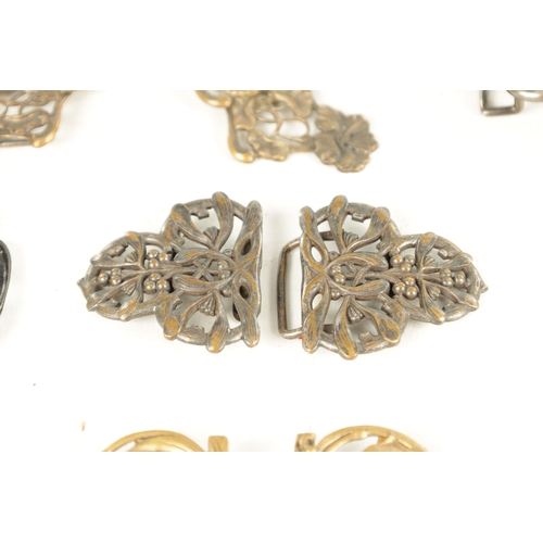 453 - A COLLECTION OF TEN 19TH CENTURY ART NOUVEAU SILVER AND SILVER METAL BELT BUCKLES of varying designs... 