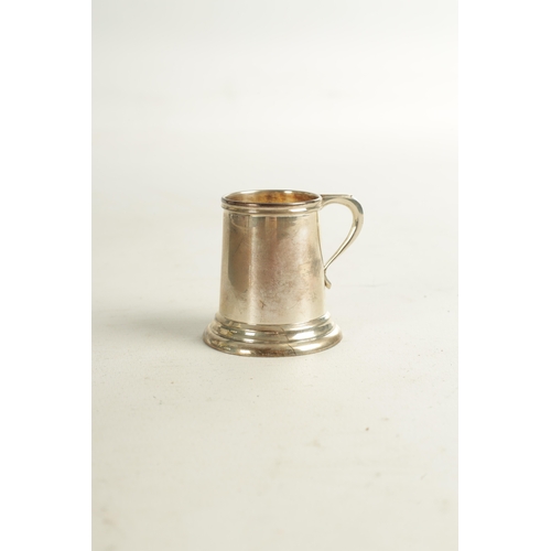 454 - A CASED SET OF 6 STERLING SILVER SPIRIT MUGS of plain tapered form on ringed bases. 170g. (4cm high ... 