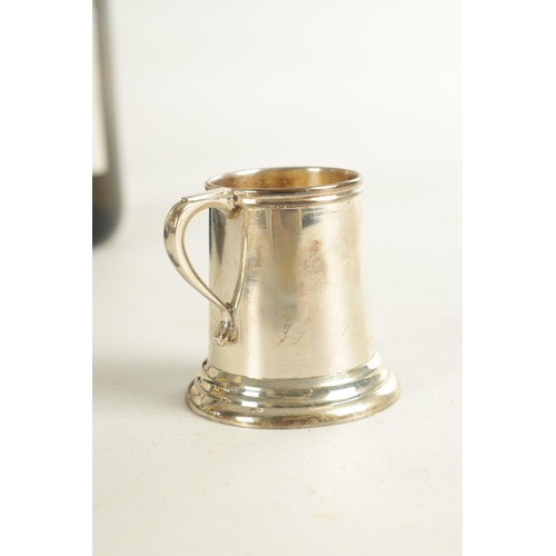 454 - A CASED SET OF 6 STERLING SILVER SPIRIT MUGS of plain tapered form on ringed bases. 170g. (4cm high ... 