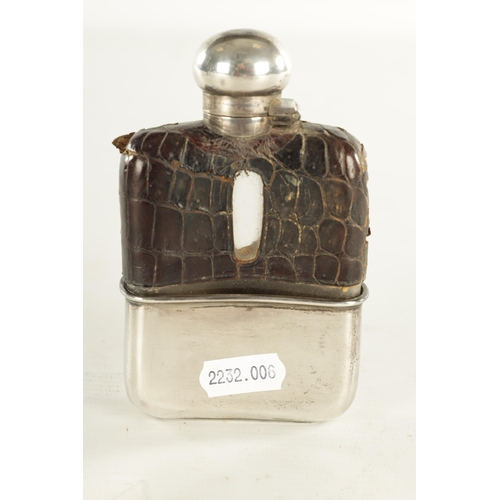 458 - A SMALL EARLY 20TH CENTURY SILVER MOUNTED CROCODILE SKIN HIP FLASK the glass body with hinged bayone... 