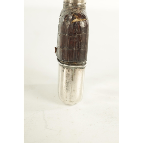 458 - A SMALL EARLY 20TH CENTURY SILVER MOUNTED CROCODILE SKIN HIP FLASK the glass body with hinged bayone... 