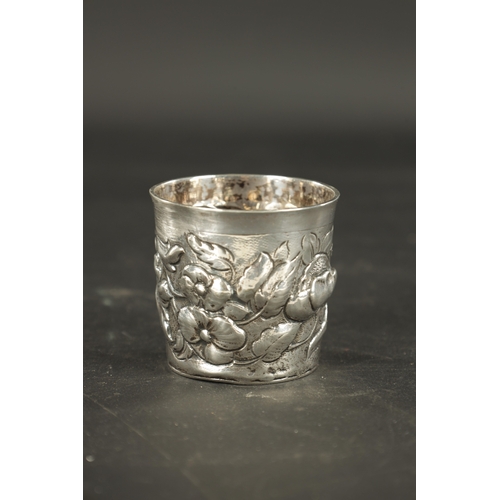 460 - A LATE 17TH CENTURY SCANDINAVIAN SILVER BEAKER embossed with flowers and contemporary cartouche engr... 