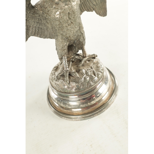 462 - A 19TH CENTURY SILVER PLATED OLD SHEFFIELD INKWELL formed as an eagle with hinged head and raised on... 