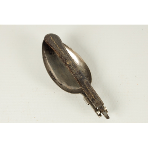 463 - AN 18TH CENTURY SILVER AND IRON WORK CONTINENTAL FOLDING SPOON with gold inlaid handle inscribed 'Ar... 