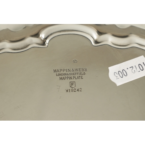 469 - A MAPPIN & WEBB SILVER PLATE SALVER with scalloped pie-crust border and four splay feet supports. (2... 