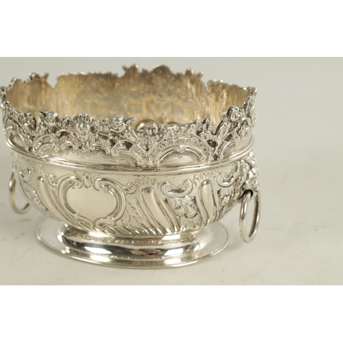 470 - A LATE 19TH CENTURY MINIATURE ROCOCO STYLE TWO-HANDLED SILVER BASKET with floral top rim above a mou... 