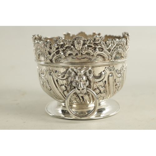 470 - A LATE 19TH CENTURY MINIATURE ROCOCO STYLE TWO-HANDLED SILVER BASKET with floral top rim above a mou... 