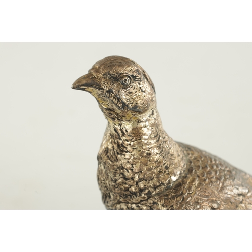 472 - A PAIR OF SILVER-PLATED PHEASANTS - stamped and numbered 2216 Copyright U.S. (38cm wide 16cm high)