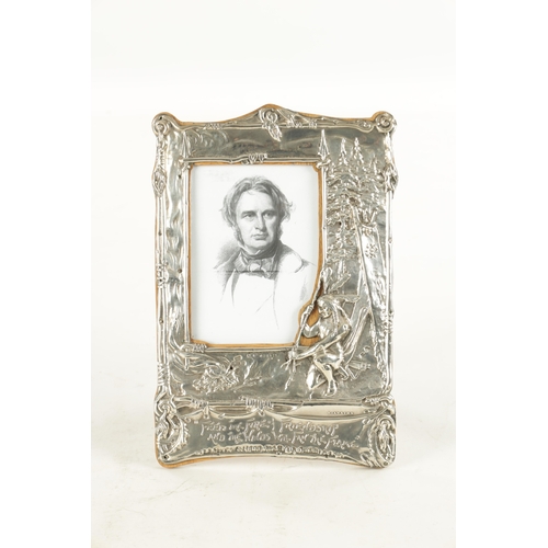 475 - AN UNUSUAL ART NOUVEAU PERIOD SILVER PICTURE FRAME, having repousse decoration depicting the Native ... 