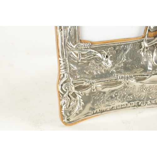 475 - AN UNUSUAL ART NOUVEAU PERIOD SILVER PICTURE FRAME, having repousse decoration depicting the Native ... 