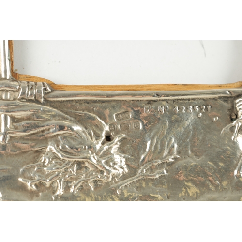 475 - AN UNUSUAL ART NOUVEAU PERIOD SILVER PICTURE FRAME, having repousse decoration depicting the Native ... 